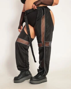 Evolution Chaps With Silver Reflective Stripes & Fishnet Panels -iHeartRaves Shop Evolution Chaps with Silver Reflective Stripes Fishnet Panels C1 BlkSlvr Side
